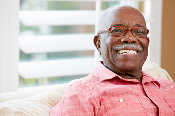 Smiling man sitting on couch